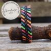Linienmuster mit Rauten in Schwarz und Neonfarben