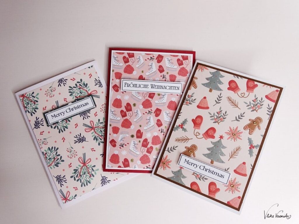 Drei selbstgebastelte Weihnachtskarten mit Schriftzügen zum Herunterladen.